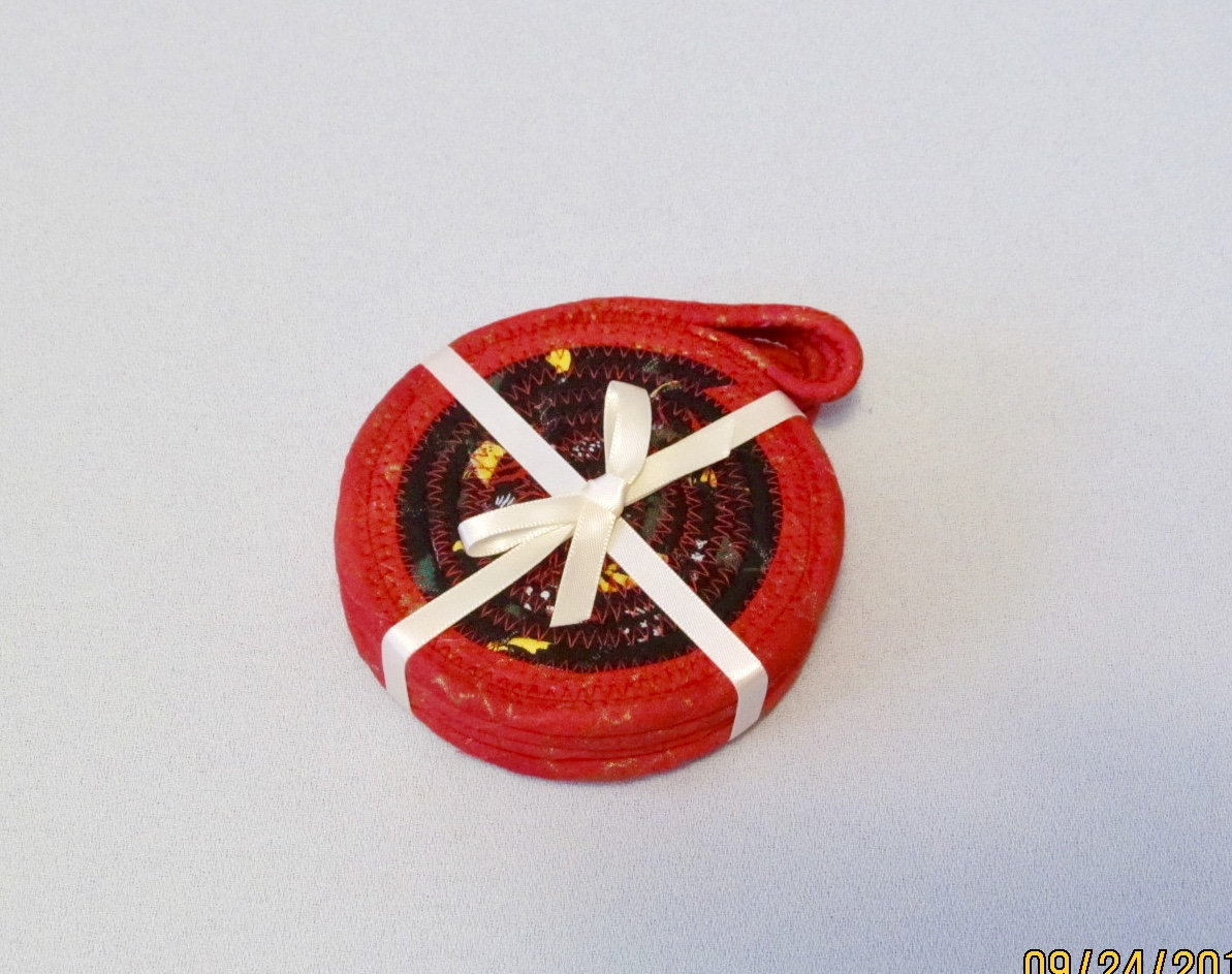 Set Of Four Cotton Fabric Red And Black Round Coasters